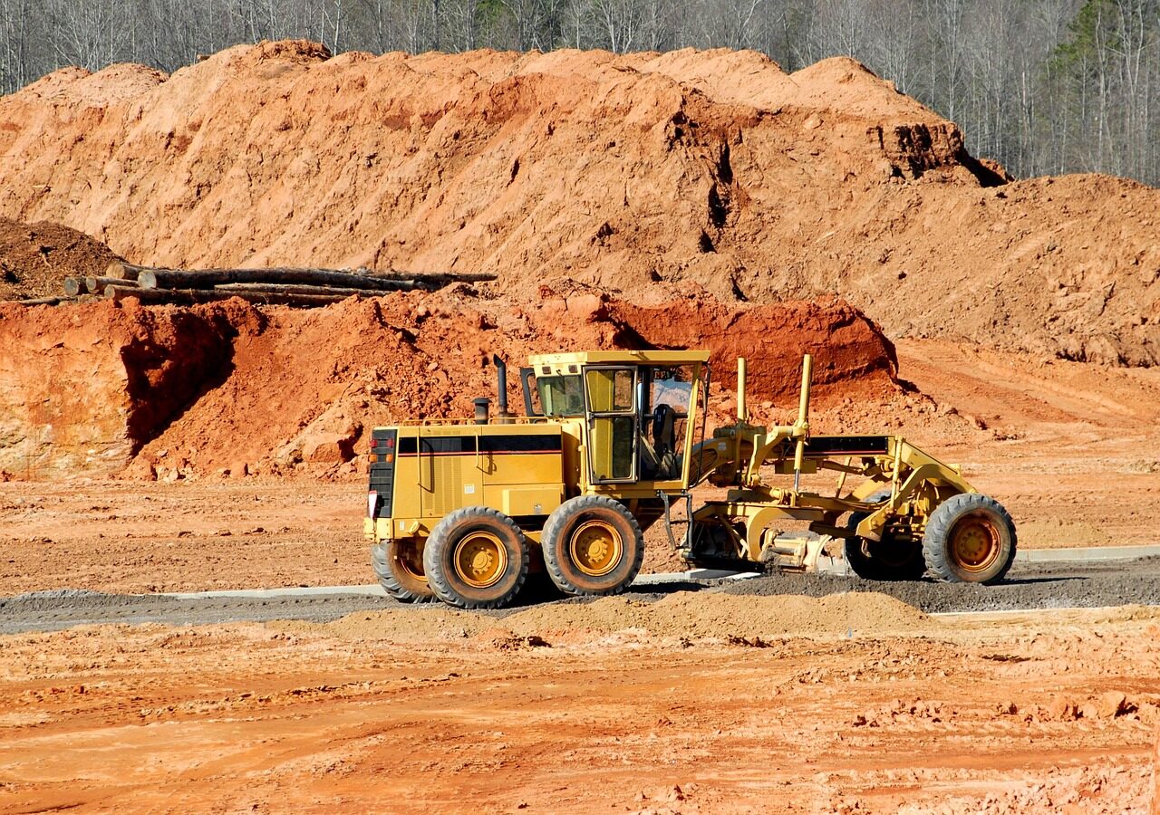 construction site, heavy equipment, dirt mover, construction, equipment, industrial, machinery, machine, work, industry, building, vehicle, excavator, bulldozer, yellow, earth, hydraulic, metal, ground, shovel, dig, build, sand, dirt, loader, development, road, excavation, construction equipment, site, gravel, bucket, soil, worker, nature, sky, job, engineering, tractor, orange sky, orange earth, orange work, orange road, orange building, orange construction, orange job, orange metal, orange sand, orange industry